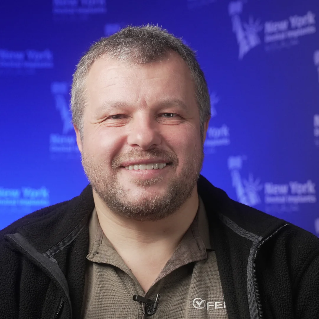 Anton P. after upper arch treatment at New York Dental Implants